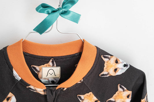 Keeping your child's wardrobe up to date: Fox bomber style jacket from Snella hanging on a coat hanger.