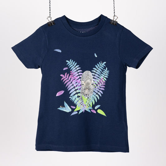Navy blue children's t-shirt hanging like a piece of art. Featuring a digital print with a leopard sneaking out from colourful bushes. Front view.  