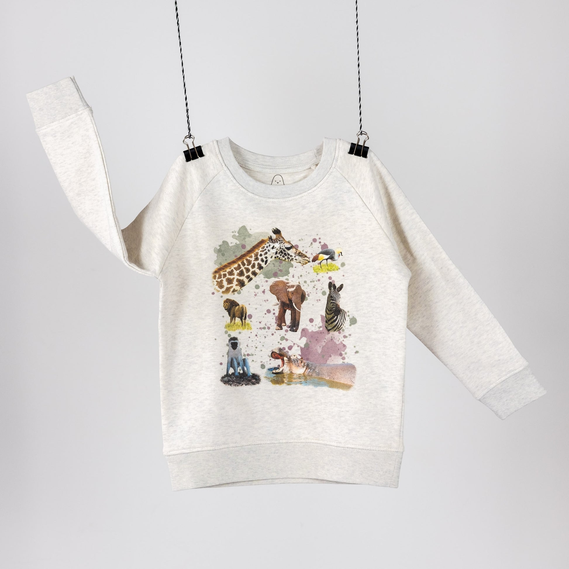Heather grey terry sweatshirt for children. Featuring digital print with wild safari animals and paint splashes. Discrete logo printed in the neck. Front view 